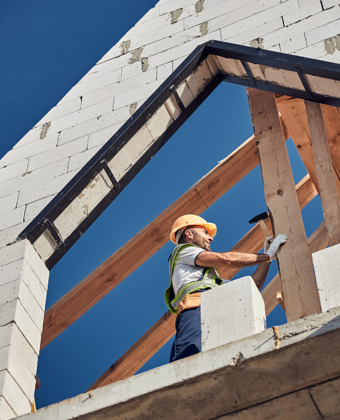 professional-builder-using-a-hammer-to-construct-a-2024-10-18-08-35-58-utc-scaled-e1732388398662.jpg